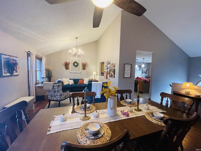 dining area featuring a textured ceiling, dark hardwood / wood-style flooring, ceiling fan with notable chandelier, and lofted ceiling