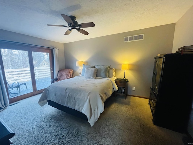 bedroom featuring access to outside, ceiling fan, dark carpet, and a textured ceiling