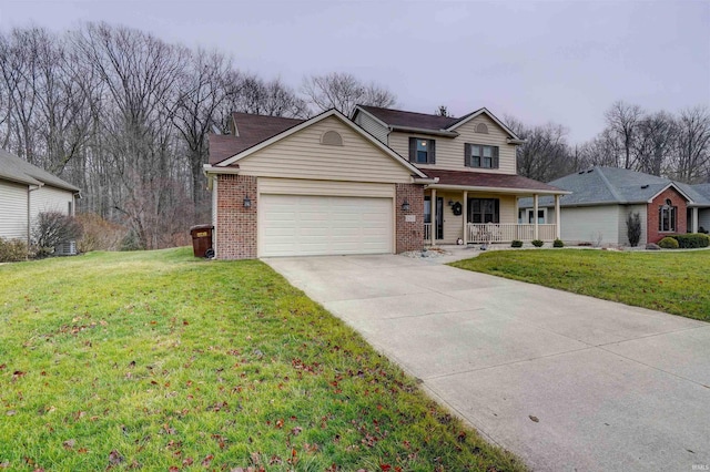 view of front facade with a porch, a garage, and a front lawn