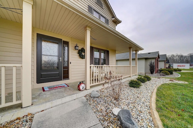 entrance to property featuring a porch