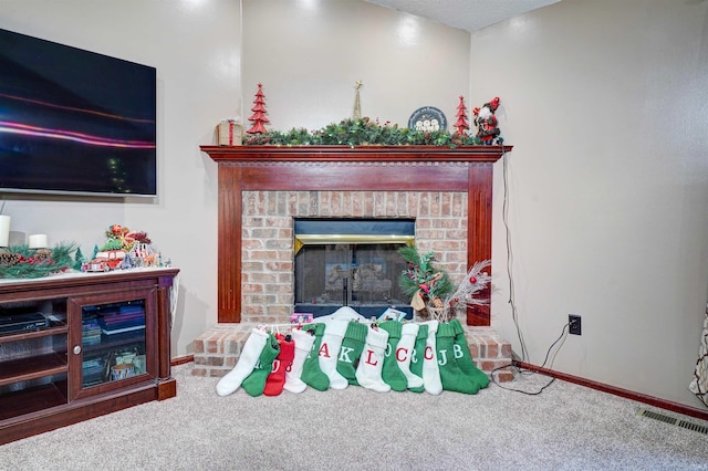 room details featuring carpet floors and a brick fireplace