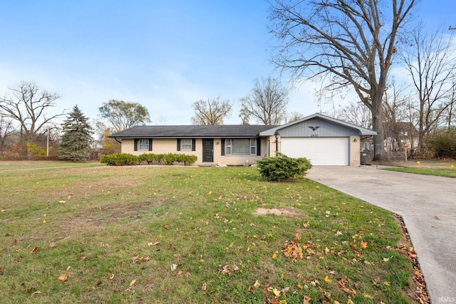 single story home with a garage and a front lawn