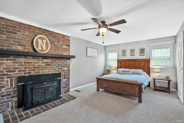 bedroom featuring multiple windows, dark carpet, ceiling fan, and wood walls