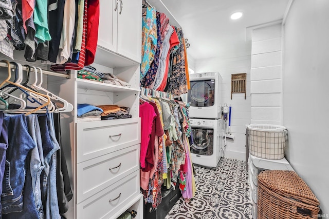 walk in closet featuring stacked washer / drying machine