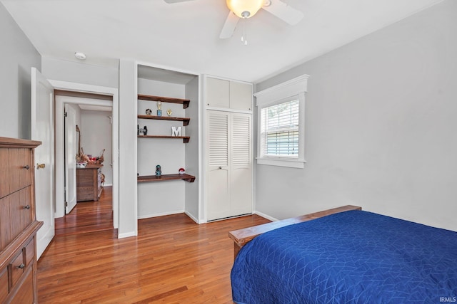 bedroom featuring wood-type flooring, a closet, and ceiling fan