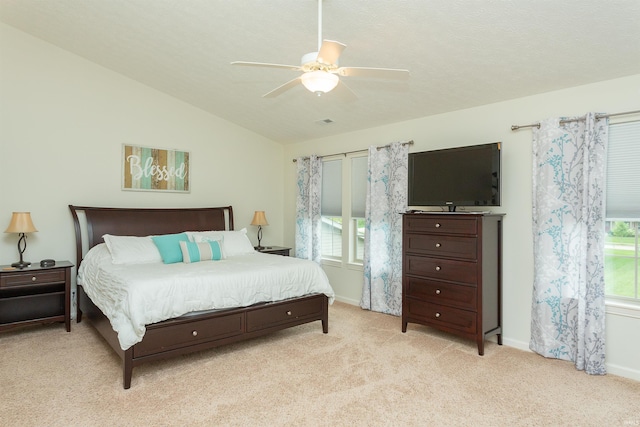 bedroom featuring ceiling fan, light carpet, and lofted ceiling