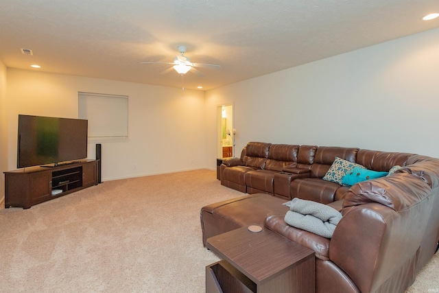 living room with ceiling fan and light colored carpet