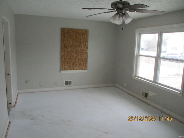 unfurnished room featuring ceiling fan