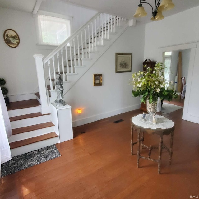 stairway featuring hardwood / wood-style floors