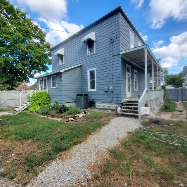 rear view of house with a porch