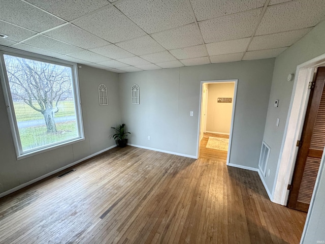 unfurnished room with wood-type flooring