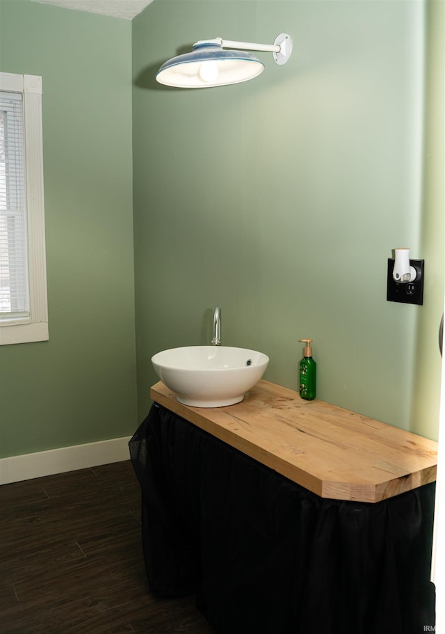 bathroom with hardwood / wood-style flooring and vanity