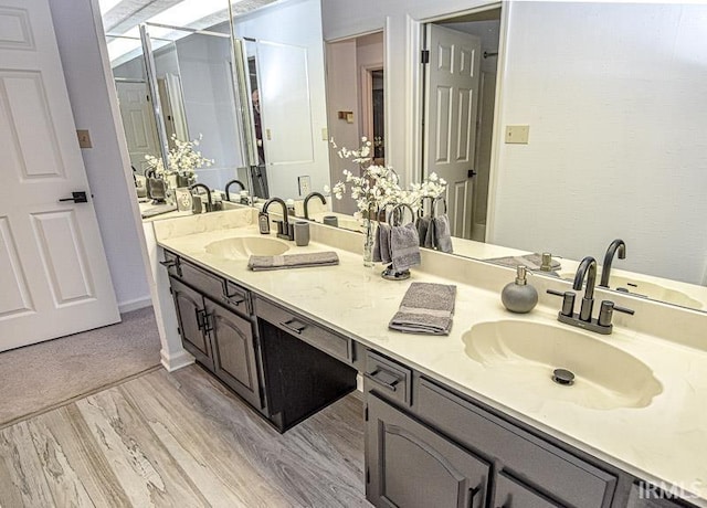 bathroom featuring hardwood / wood-style flooring and vanity