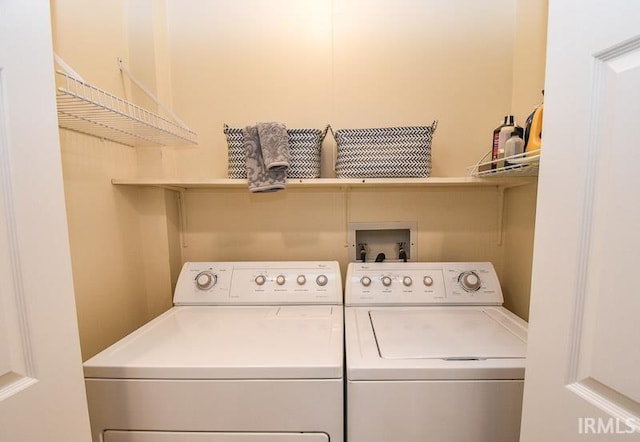 clothes washing area featuring washing machine and dryer