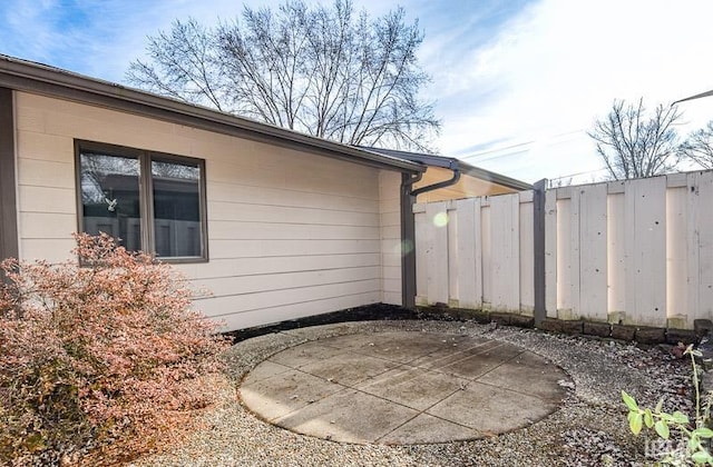 view of side of property with a patio