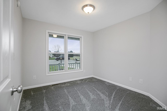 unfurnished room with carpet