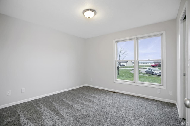 empty room featuring carpet flooring