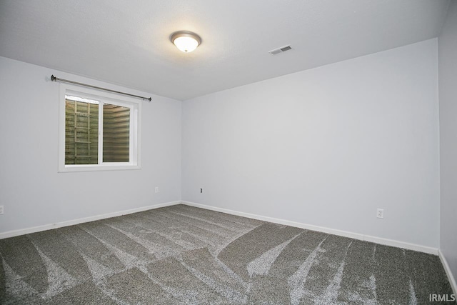 spare room featuring carpet flooring