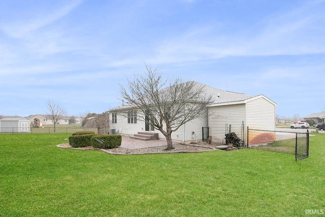 back of property with a lawn and a patio