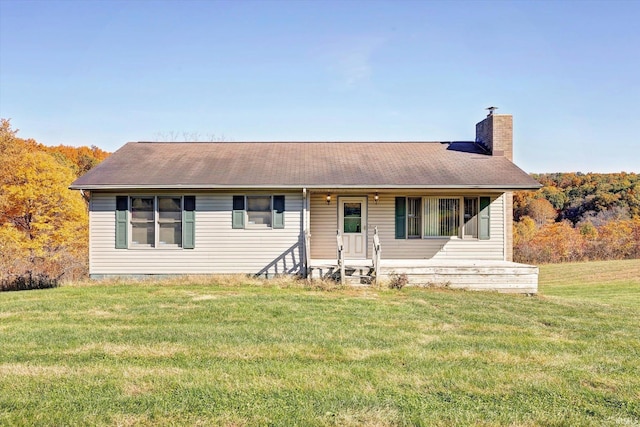 ranch-style home with a front lawn