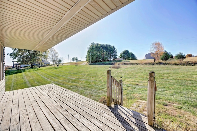 wooden terrace with a lawn