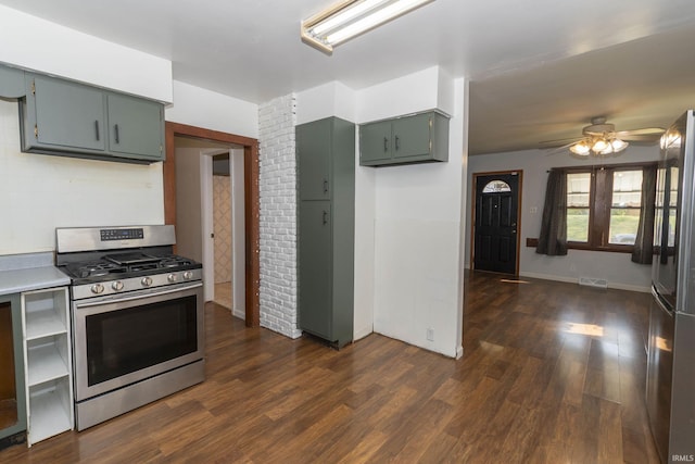 kitchen featuring ceiling fan, dark hardwood / wood-style flooring, and stainless steel appliances