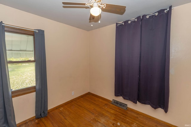 empty room featuring hardwood / wood-style floors and ceiling fan