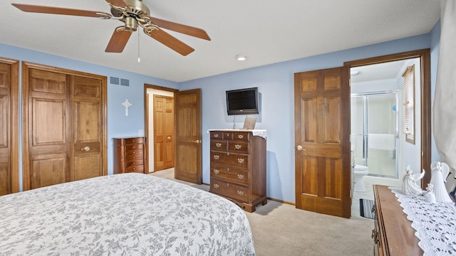 carpeted bedroom featuring ensuite bathroom and ceiling fan