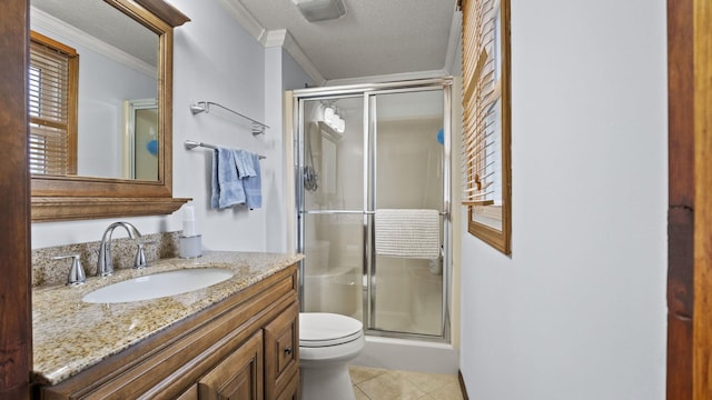 bathroom with tile patterned flooring, a textured ceiling, a shower with door, and ornamental molding