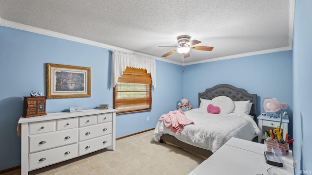 carpeted bedroom with a textured ceiling, ceiling fan, and ornamental molding