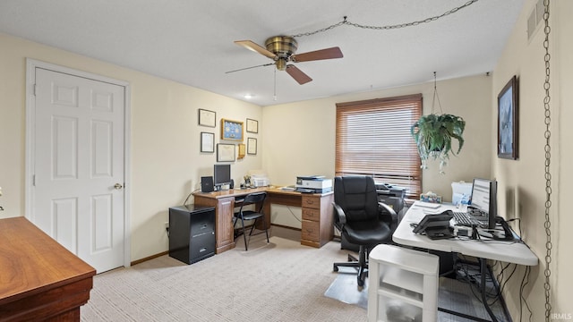 carpeted office with ceiling fan