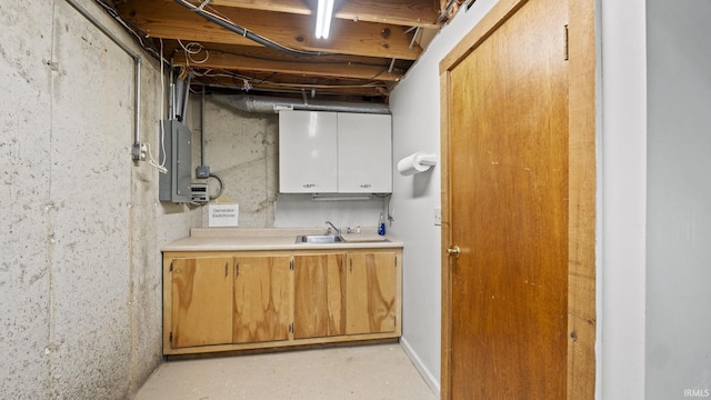 basement featuring sink and electric panel