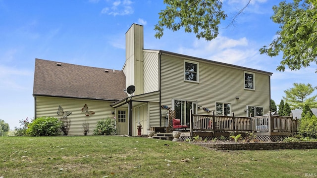 back of house with a lawn and a wooden deck