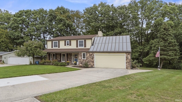 view of front of property featuring a porch, a garage, and a front lawn