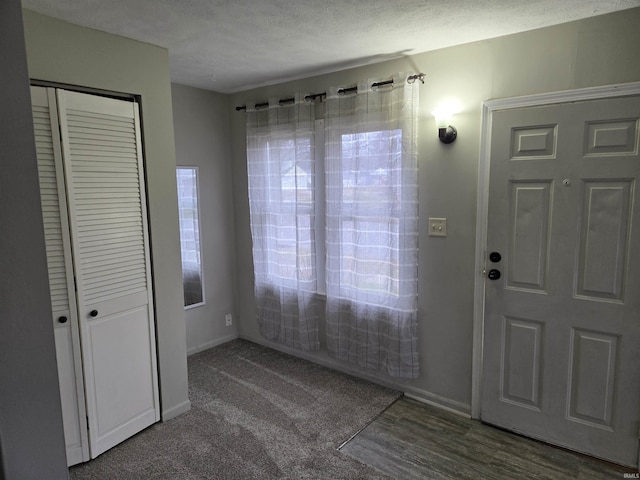 entrance foyer featuring a textured ceiling