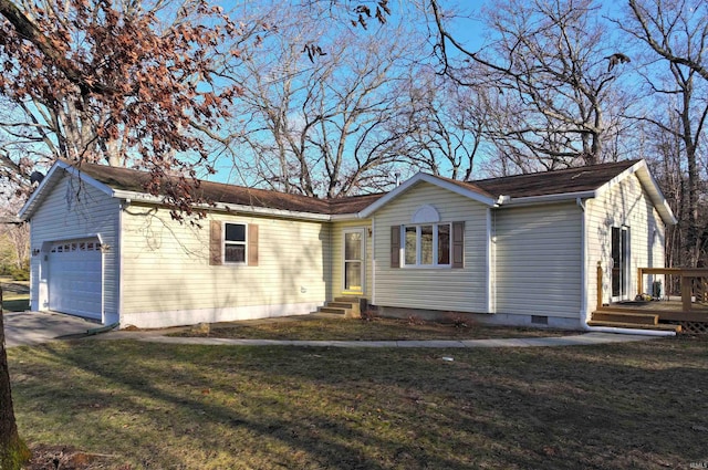 ranch-style home with a front lawn and a garage