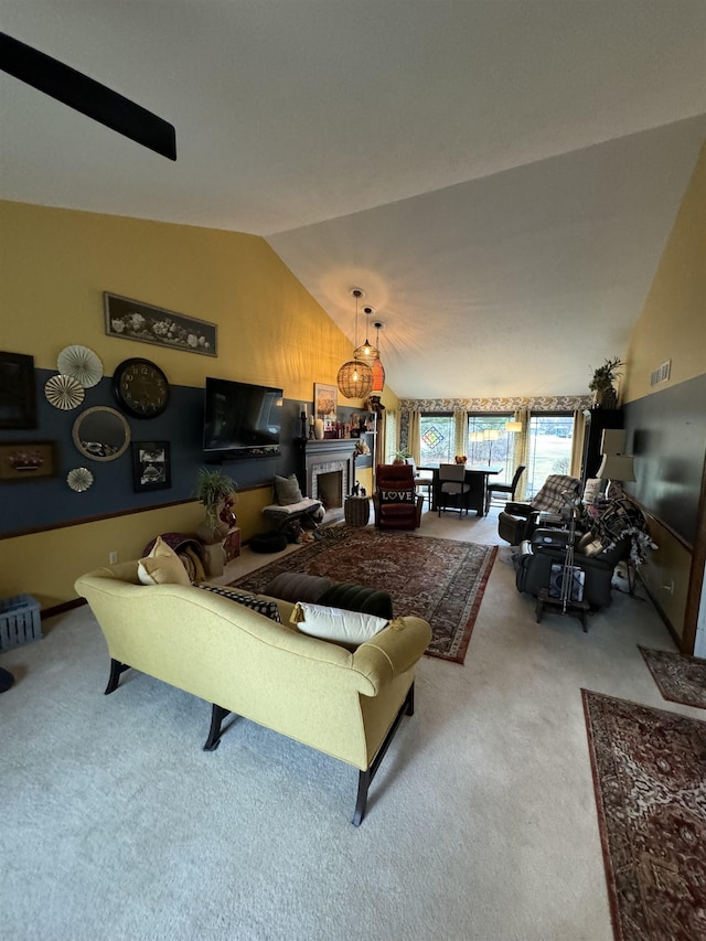 carpeted living room featuring vaulted ceiling