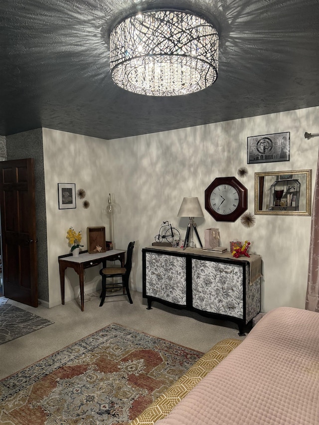 carpeted bedroom with a chandelier