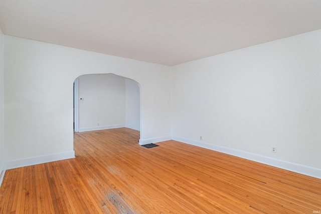 spare room featuring light hardwood / wood-style floors