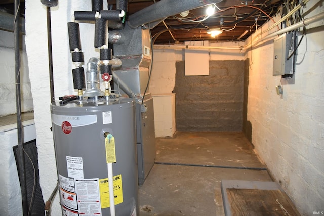 utility room featuring electric panel and gas water heater