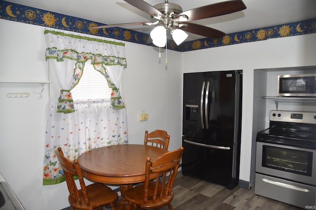 dining space featuring ceiling fan and dark hardwood / wood-style flooring