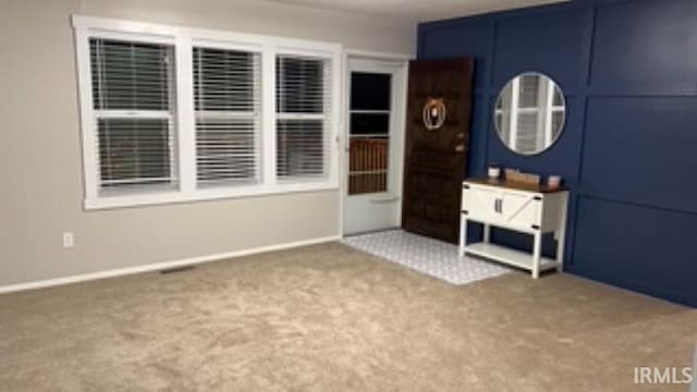 unfurnished bedroom with carpet flooring