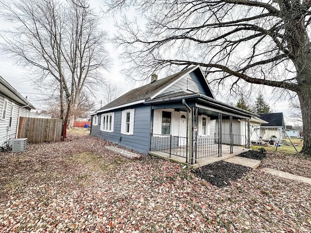 bungalow with central air condition unit and a porch