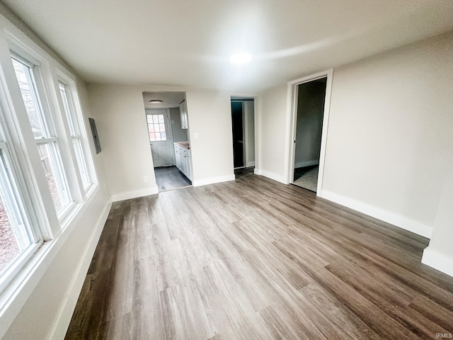 unfurnished living room with hardwood / wood-style floors