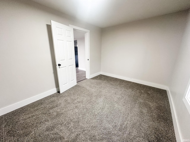 empty room with carpet flooring