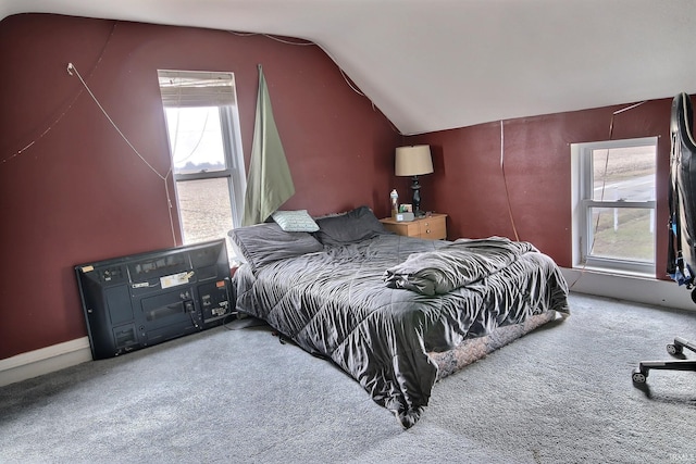 bedroom with carpet flooring and vaulted ceiling