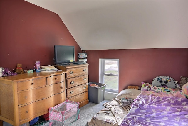 carpeted bedroom with lofted ceiling