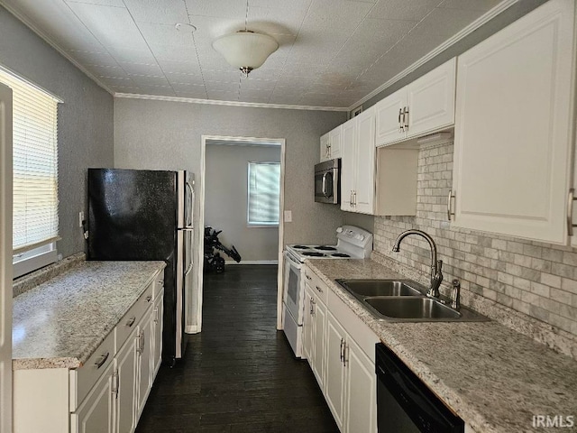 kitchen with appliances with stainless steel finishes, crown molding, white cabinetry, and sink