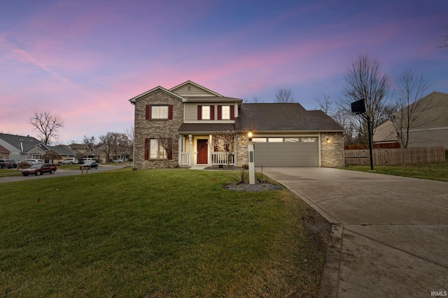 view of front of house with a lawn and a garage