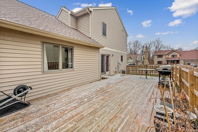 wooden terrace featuring a grill